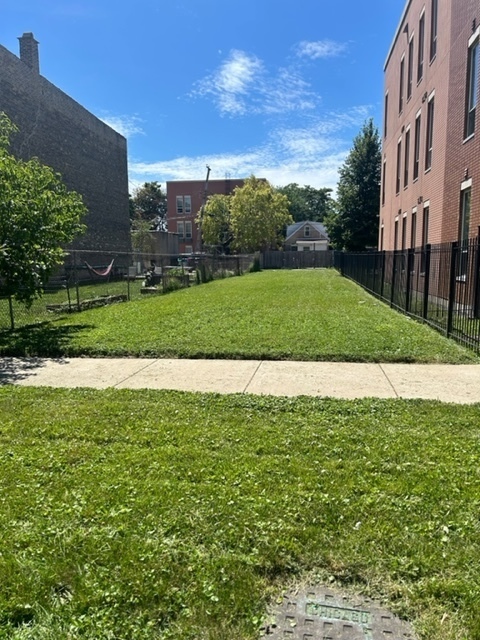 a view of a big yard with a house