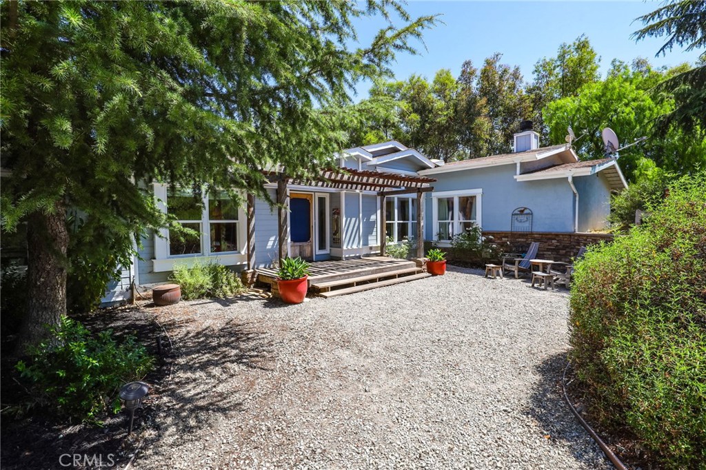 an outdoor view of house with outdoor seating