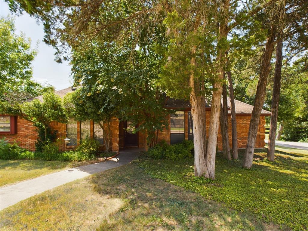 a backyard of a house with lots of green space