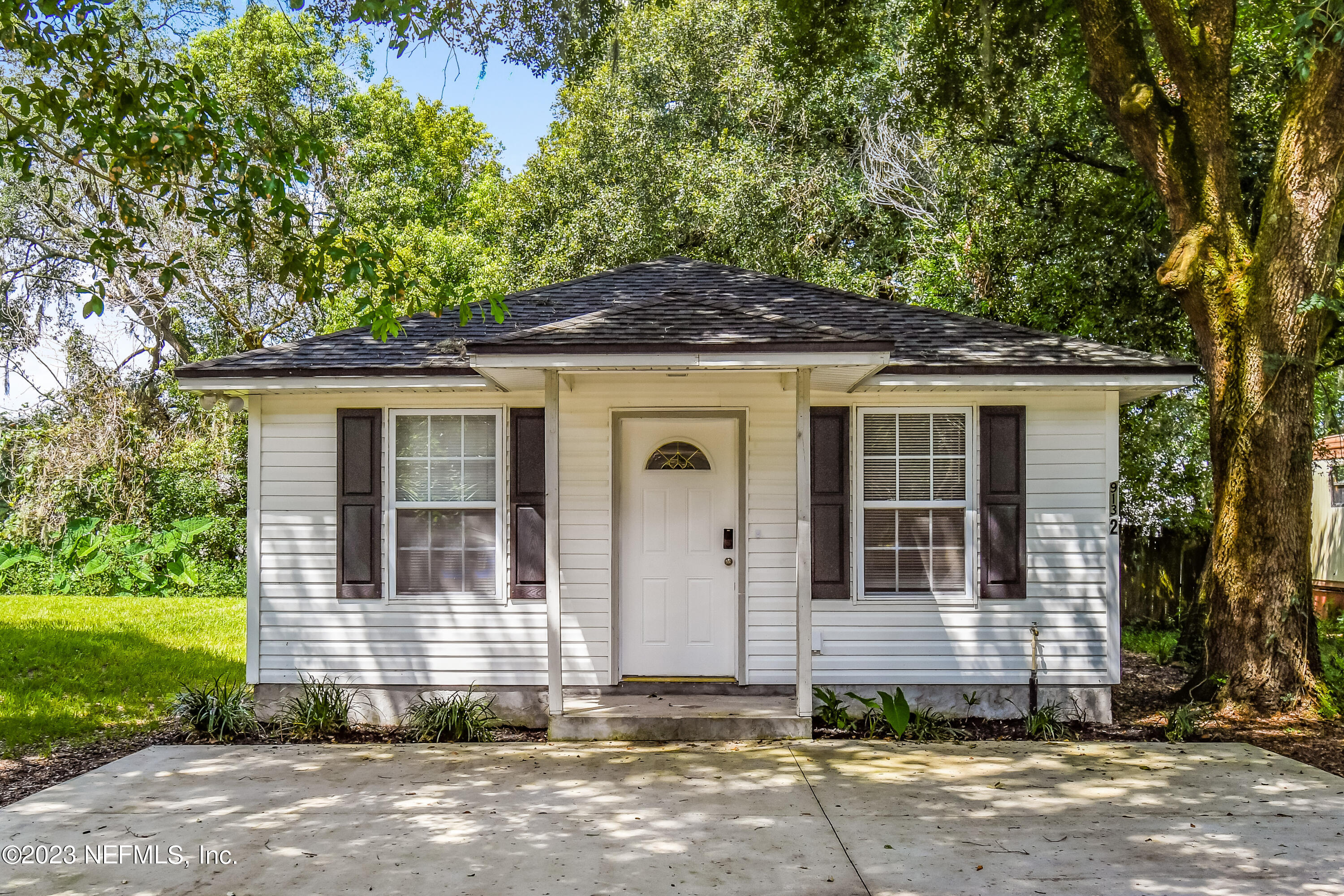 a front view of a house with a yard