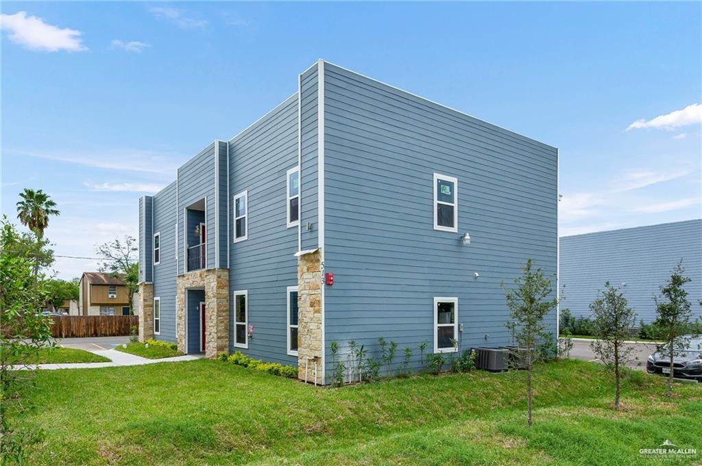 a brick house with a yard