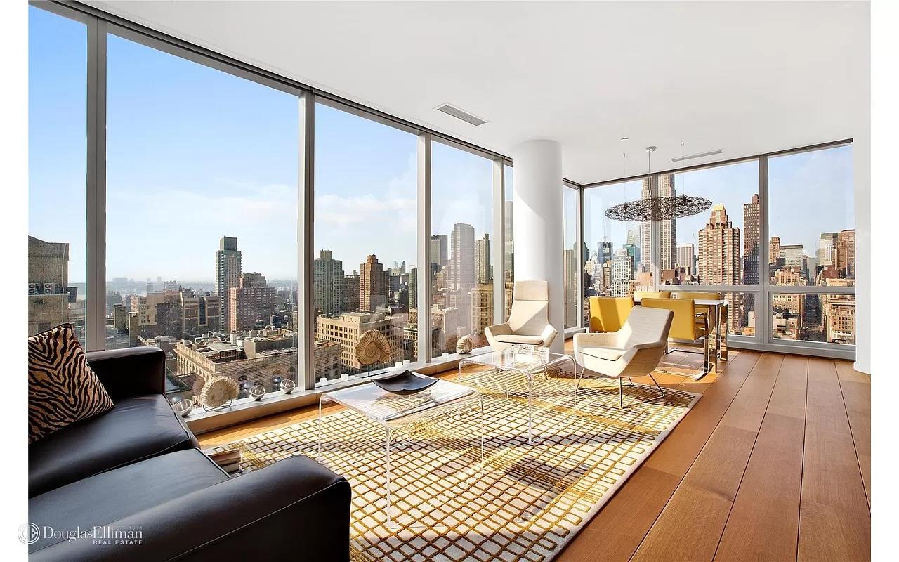 a view of living room with furniture and floor to ceiling window