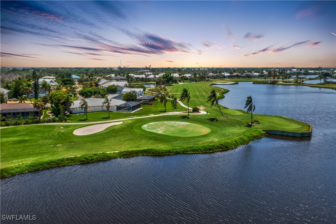 a view of a golf course with a swimming pool