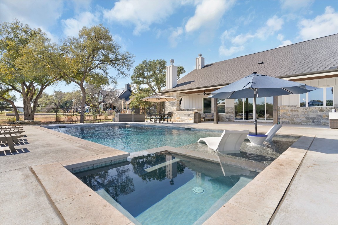 a view of a patio with swimming pool