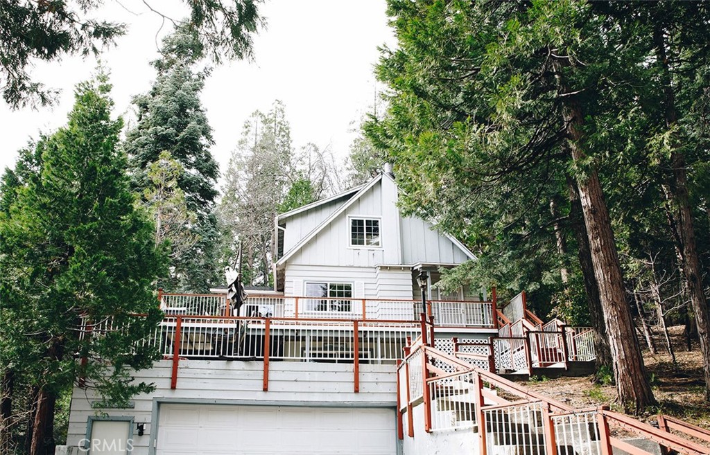 a view of house with a trees in the background