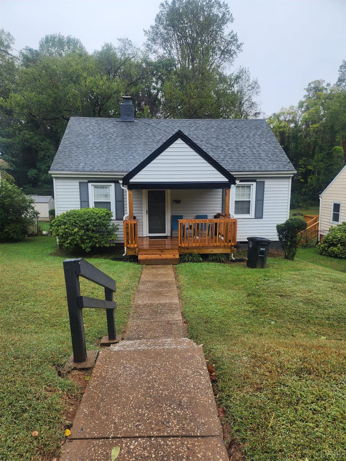 a front view of a house with a yard table and chairs