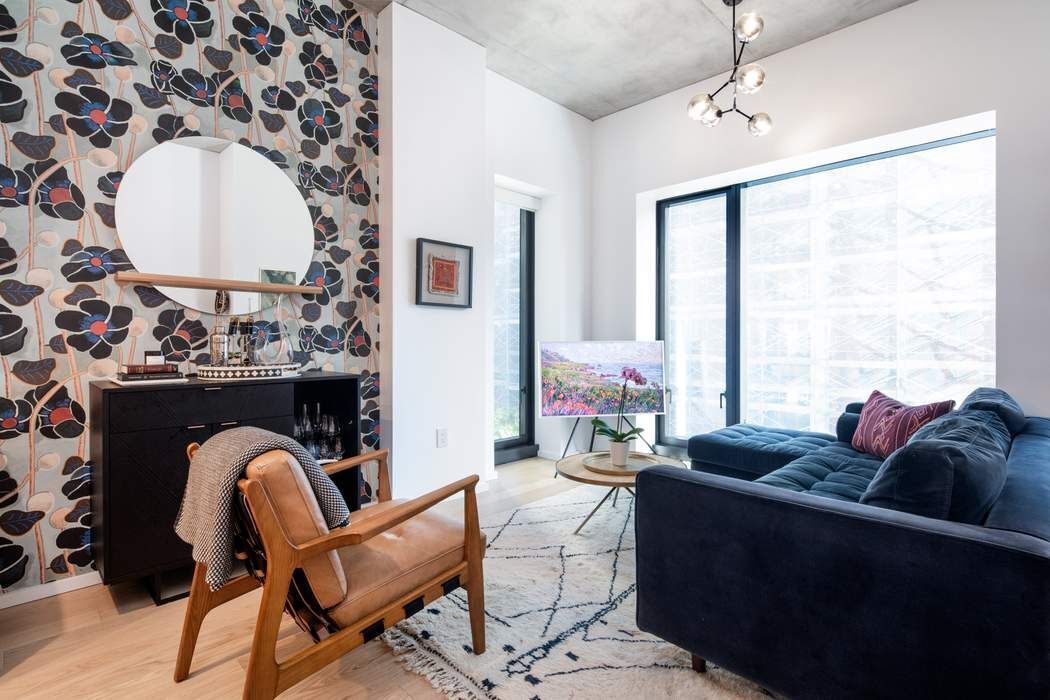 a living room with furniture and a large window