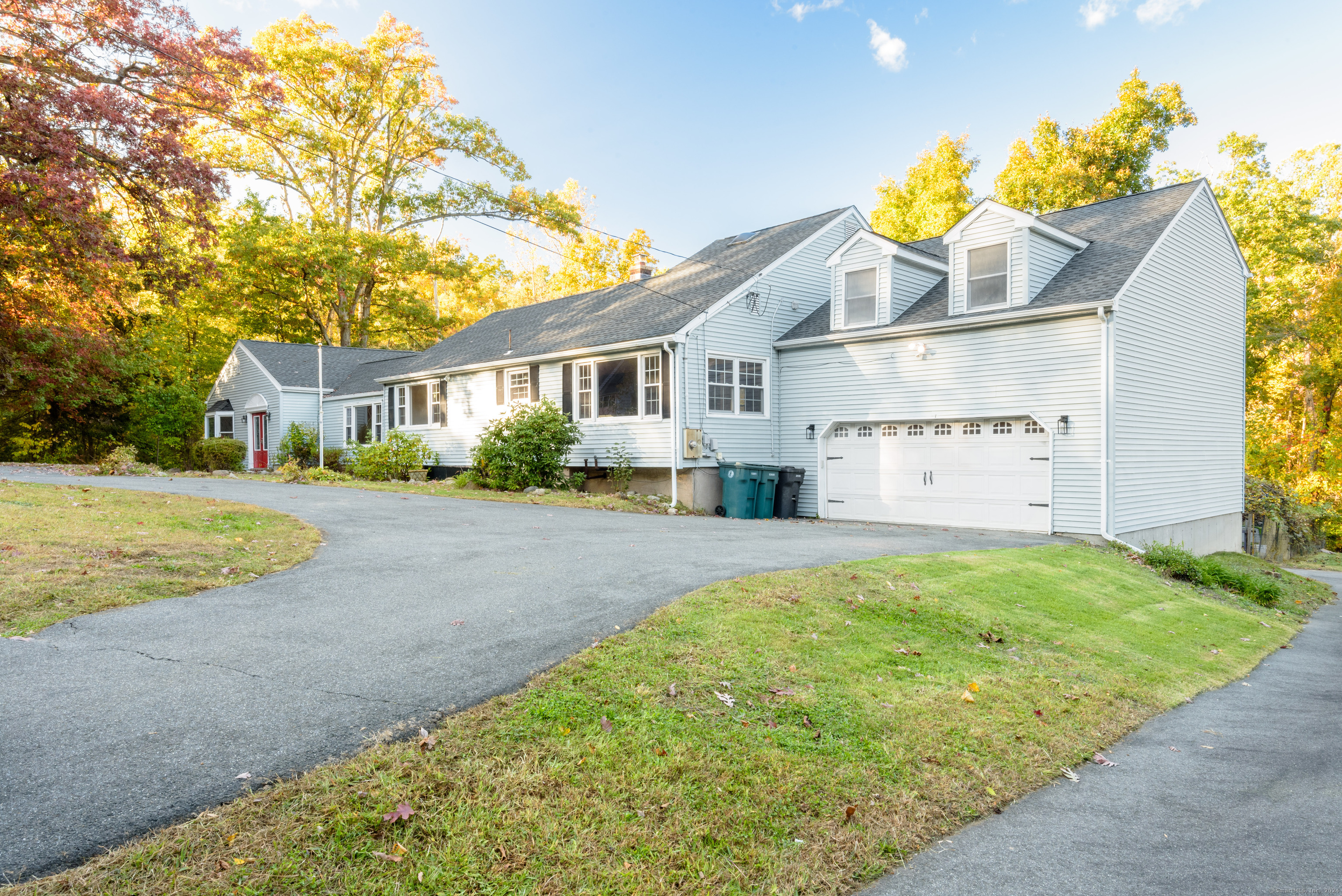 a view of house with backyard and garden