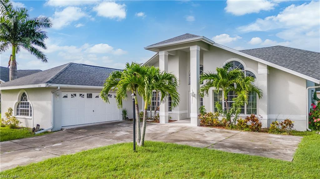 a front view of house with yard and green space