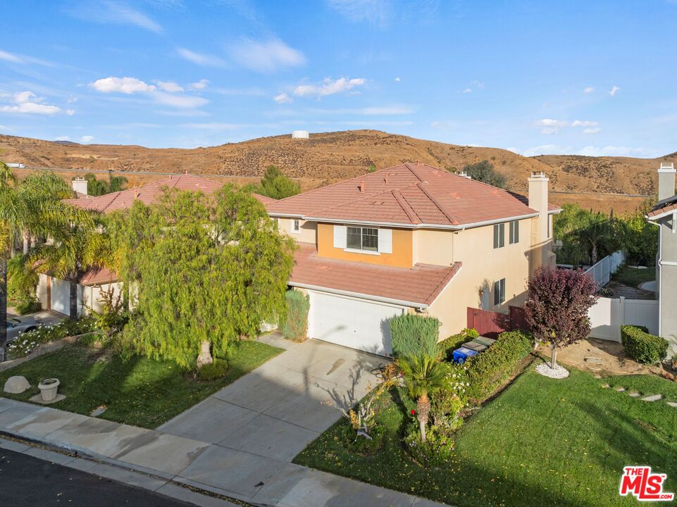 a aerial view of a house with a yard