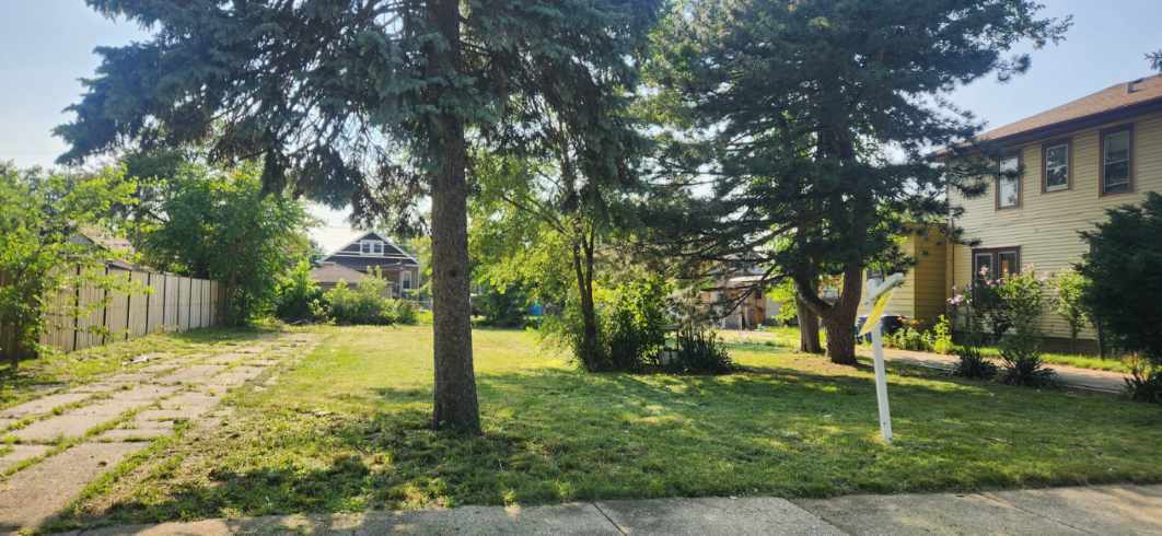 a house with trees in the background