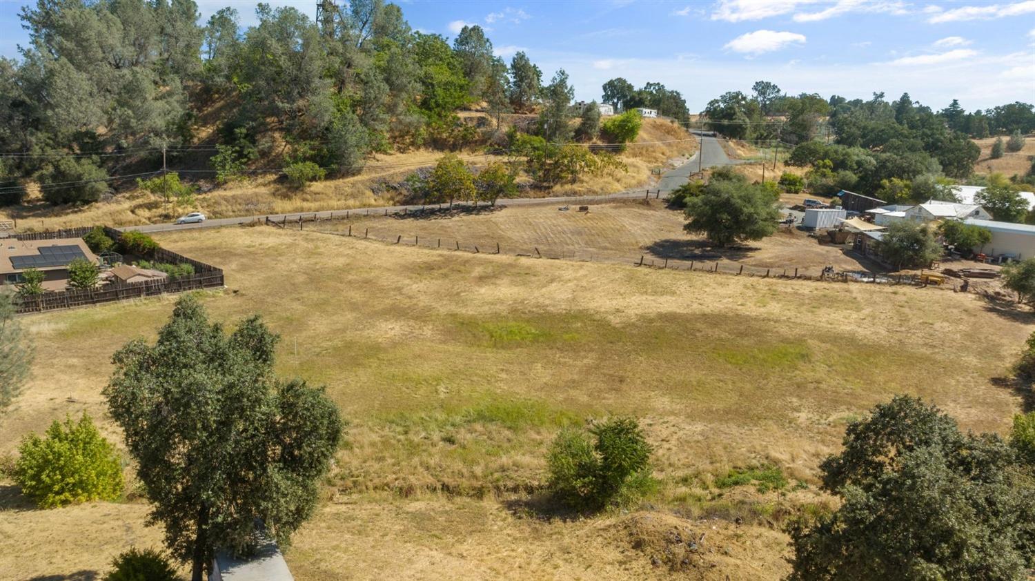 a view of a yard with trees