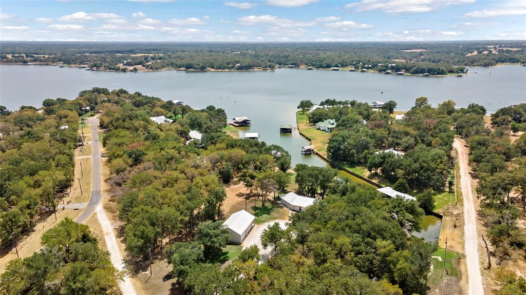 a view of a lake with houses in the back