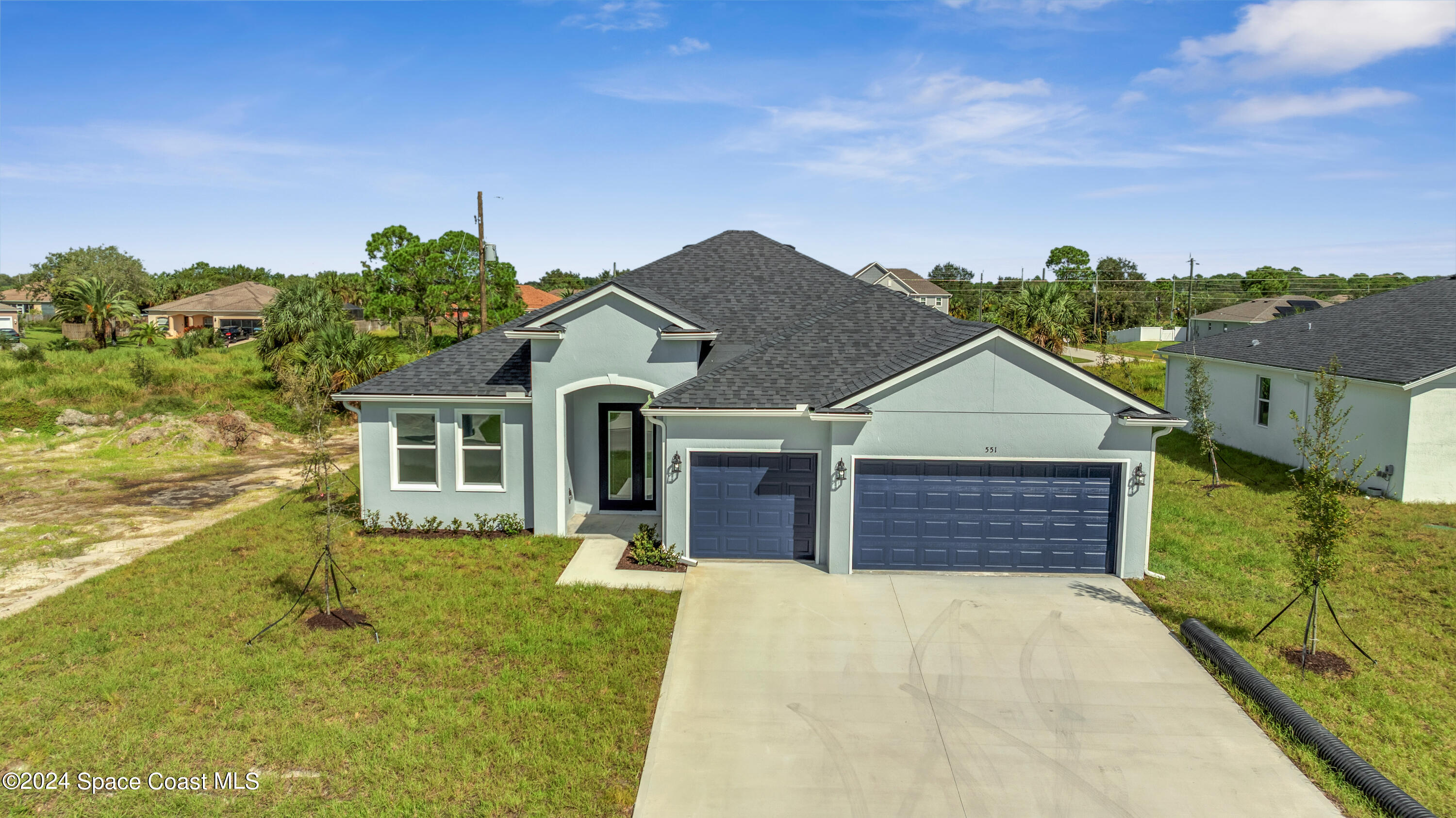 a front view of a house with a yard