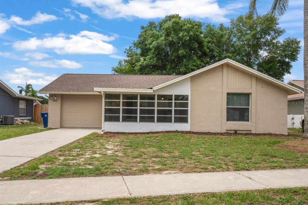 a view of a house with a yard