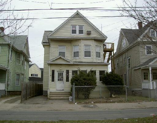 a front view of a house with garage