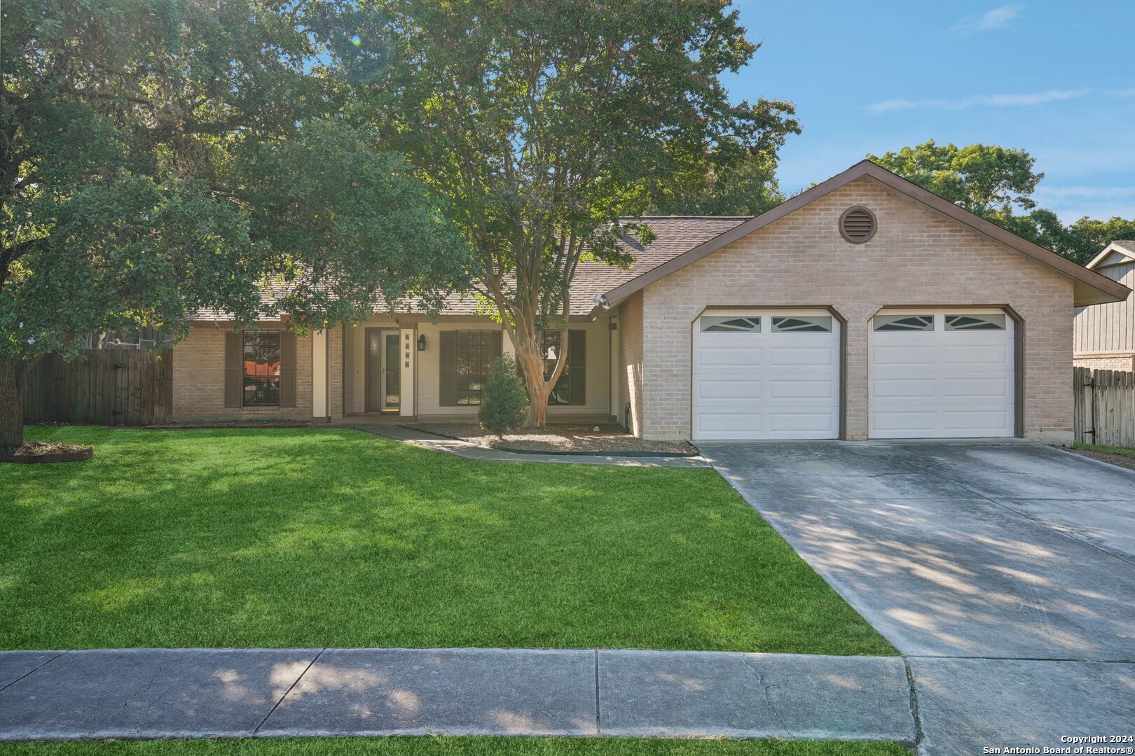 a view of a yard in front of a house