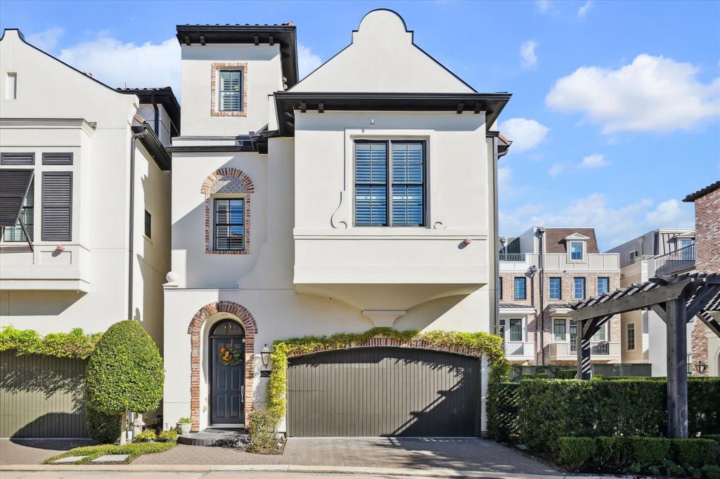 a front view of a house with garage