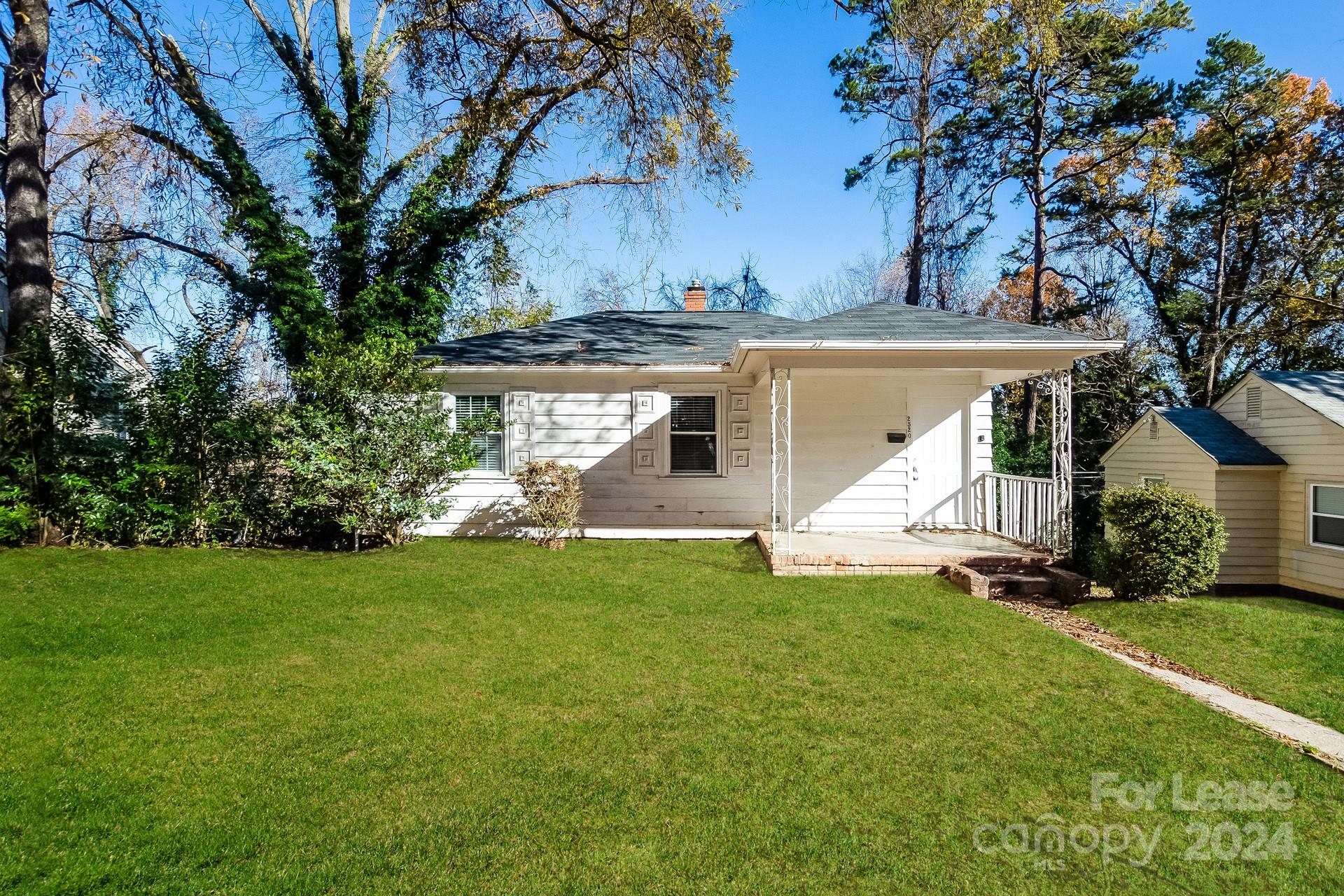 a view of a house with a yard