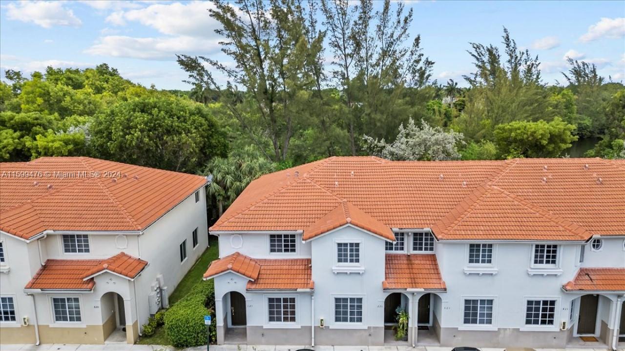 a view of multiple house with tree s