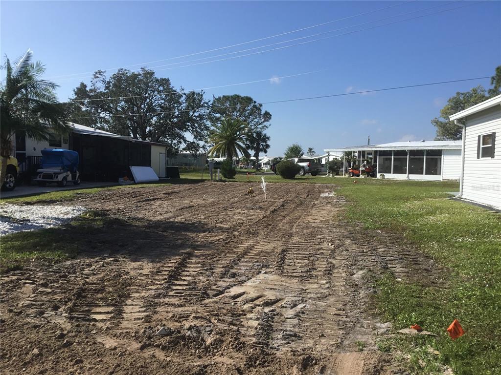 a view of a yard and front view of a house