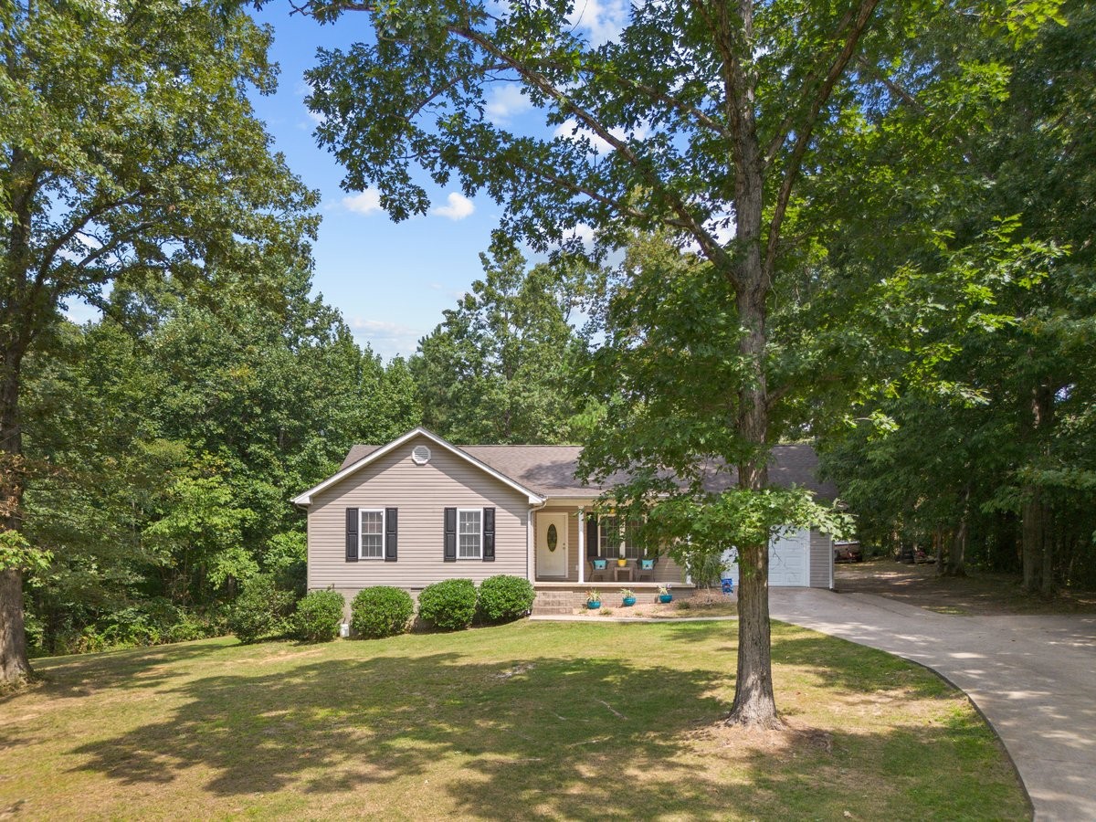 a house with trees in the background