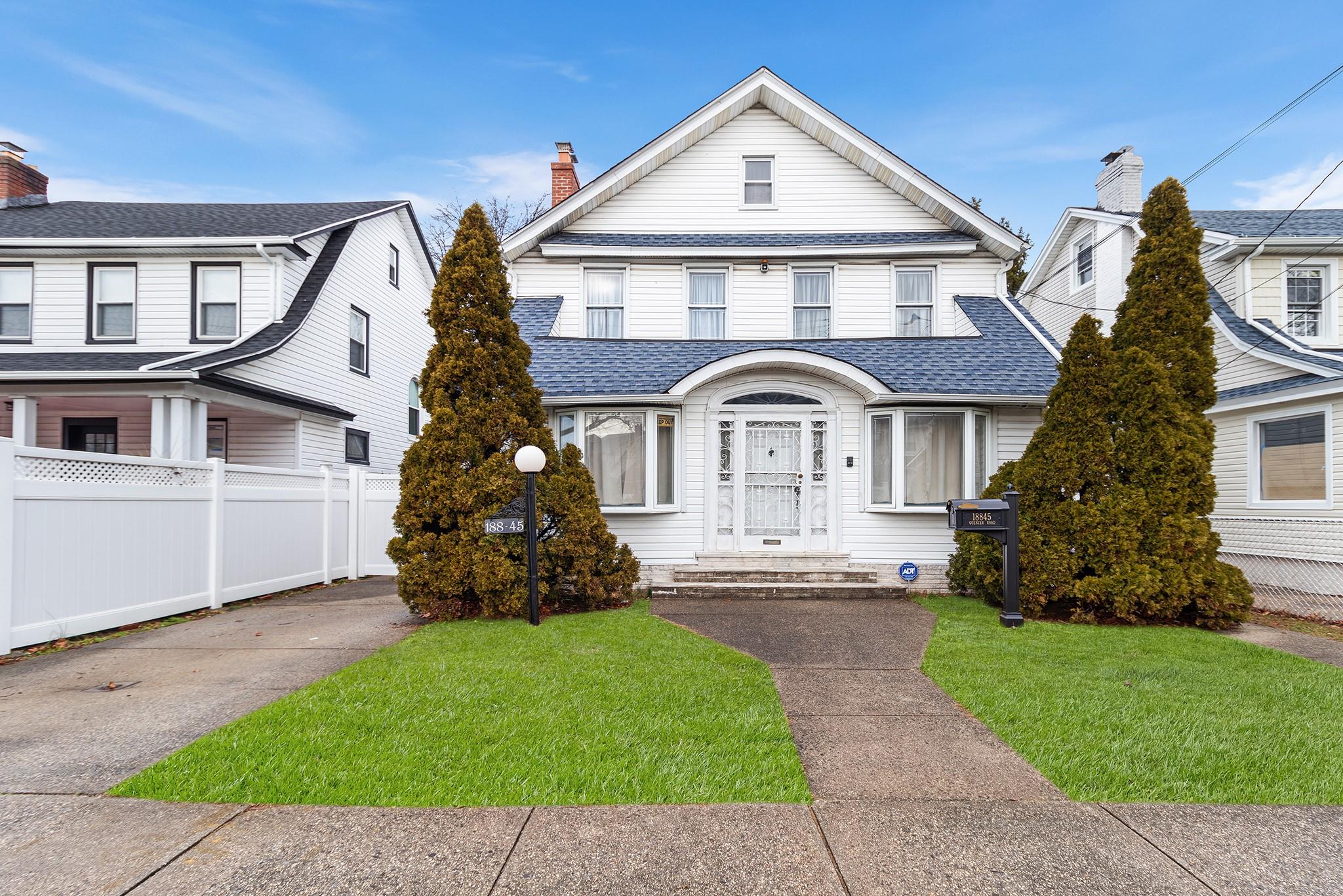 View of front of property with a front lawn