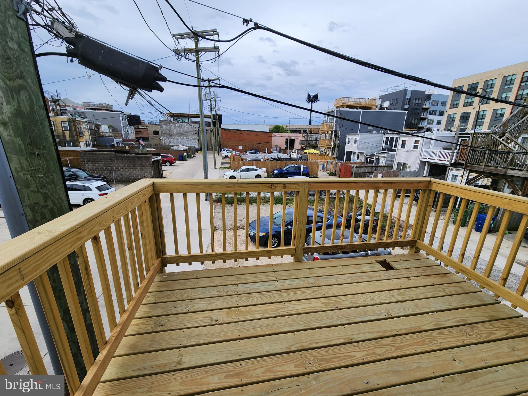 a view of a balcony with wooden floor