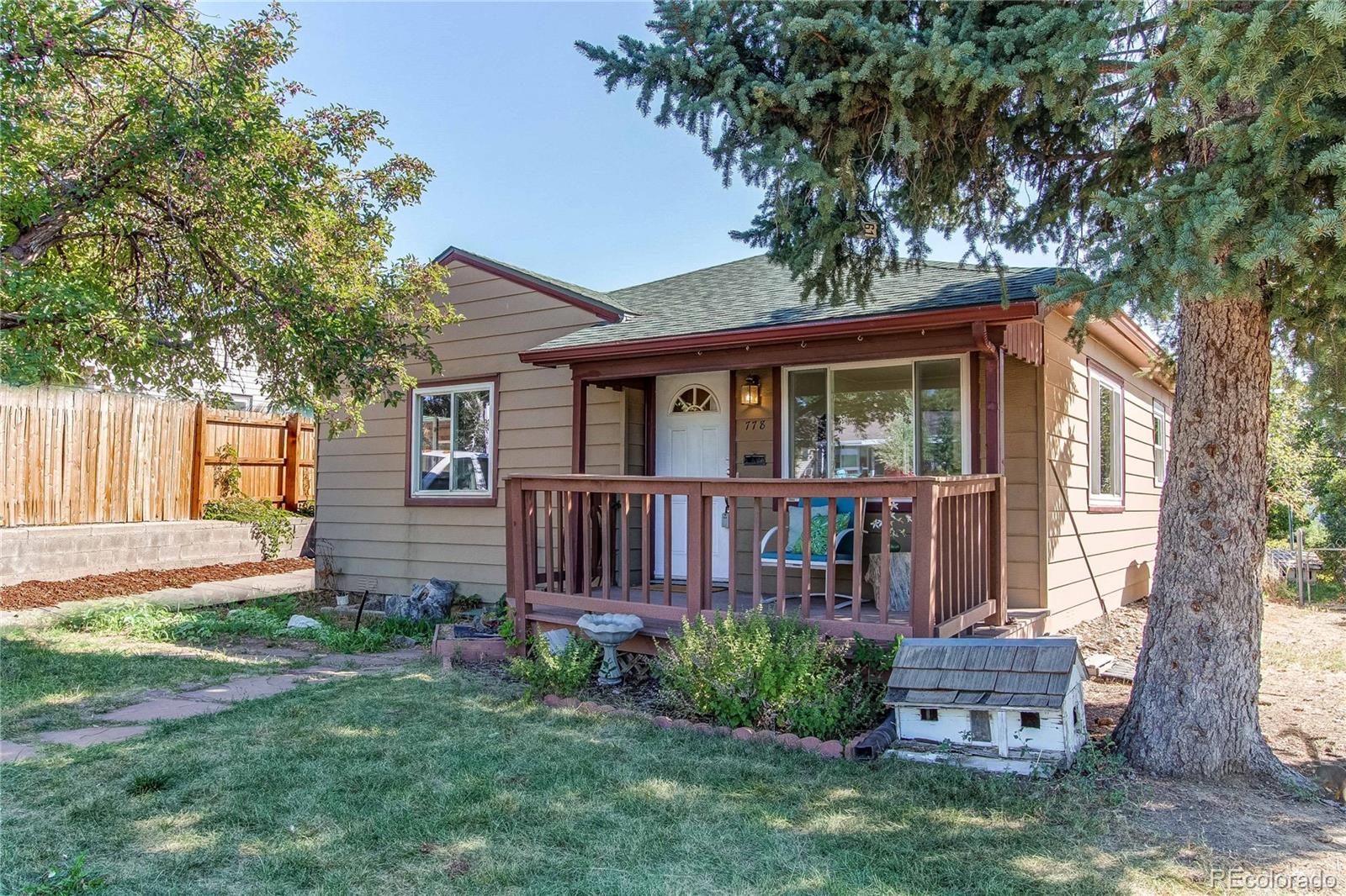 front view of a house with a yard