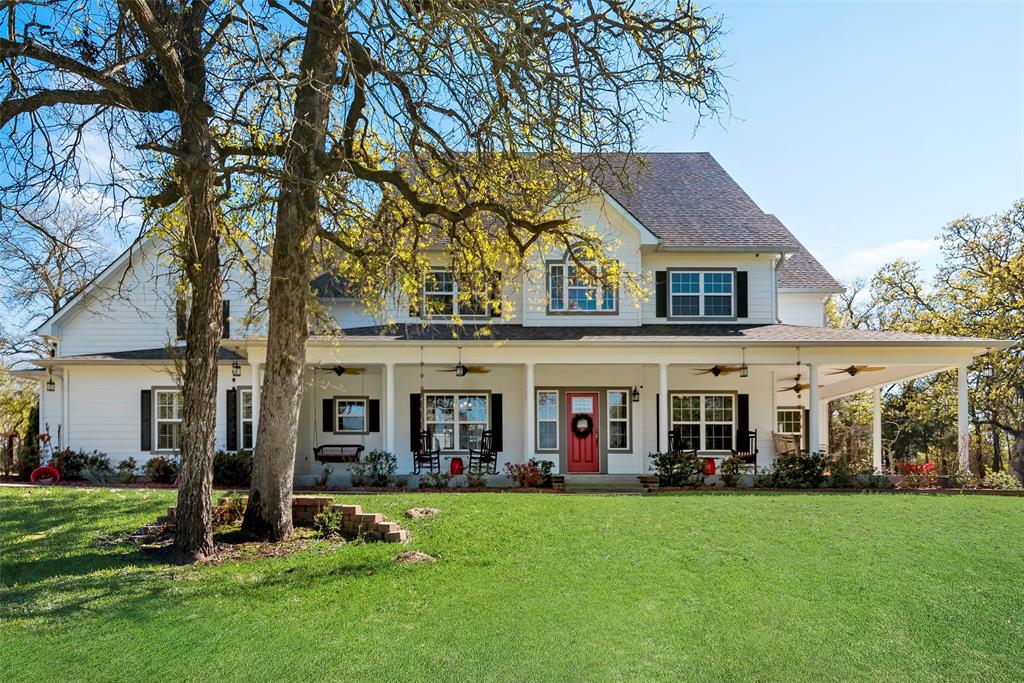 front view of a house with a yard