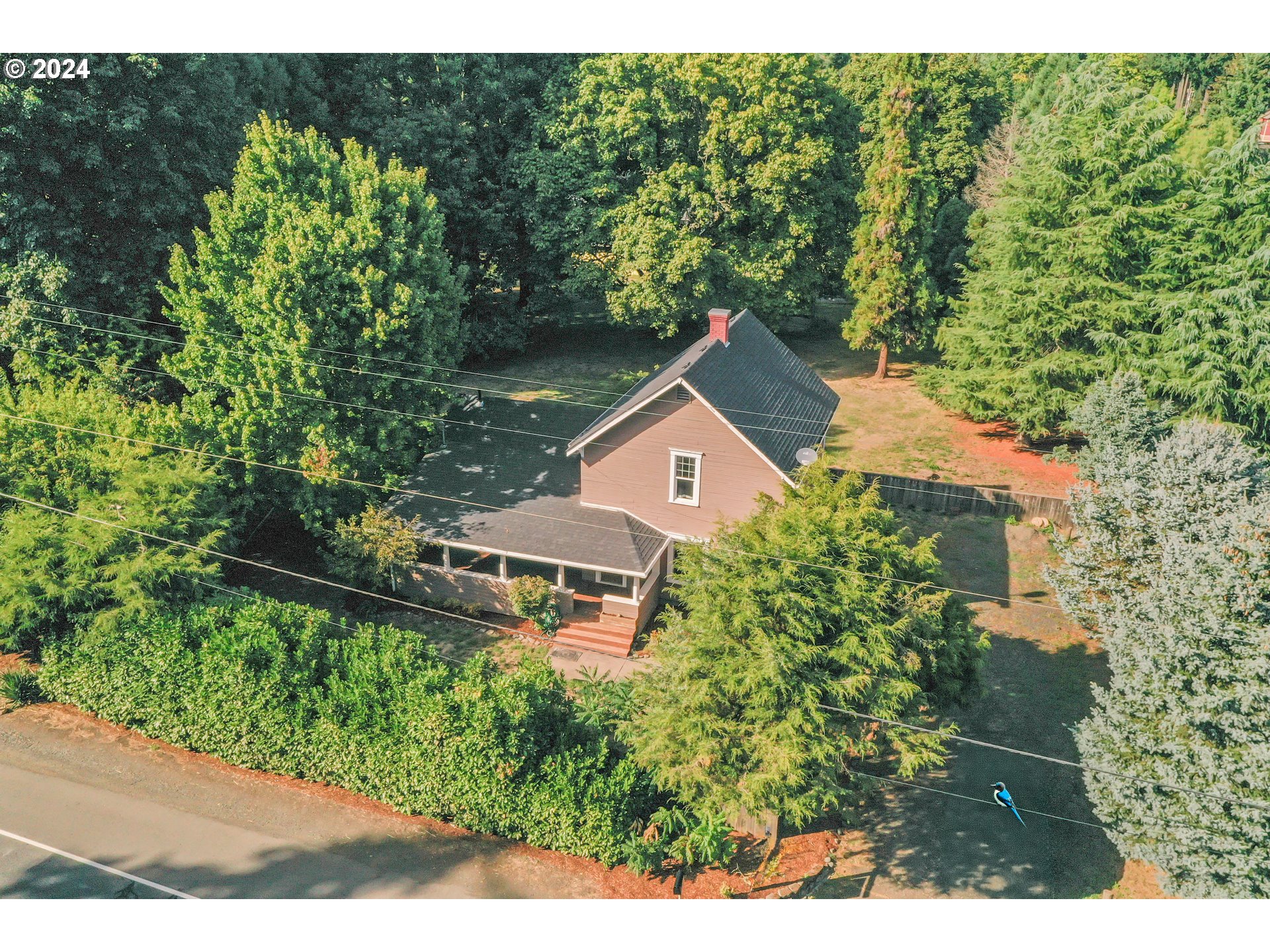 an aerial view of a house with yard swimming pool and outdoor seating