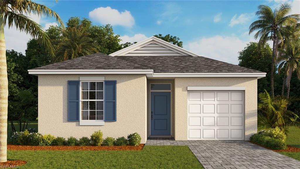 View of front of home featuring a garage and a front lawn