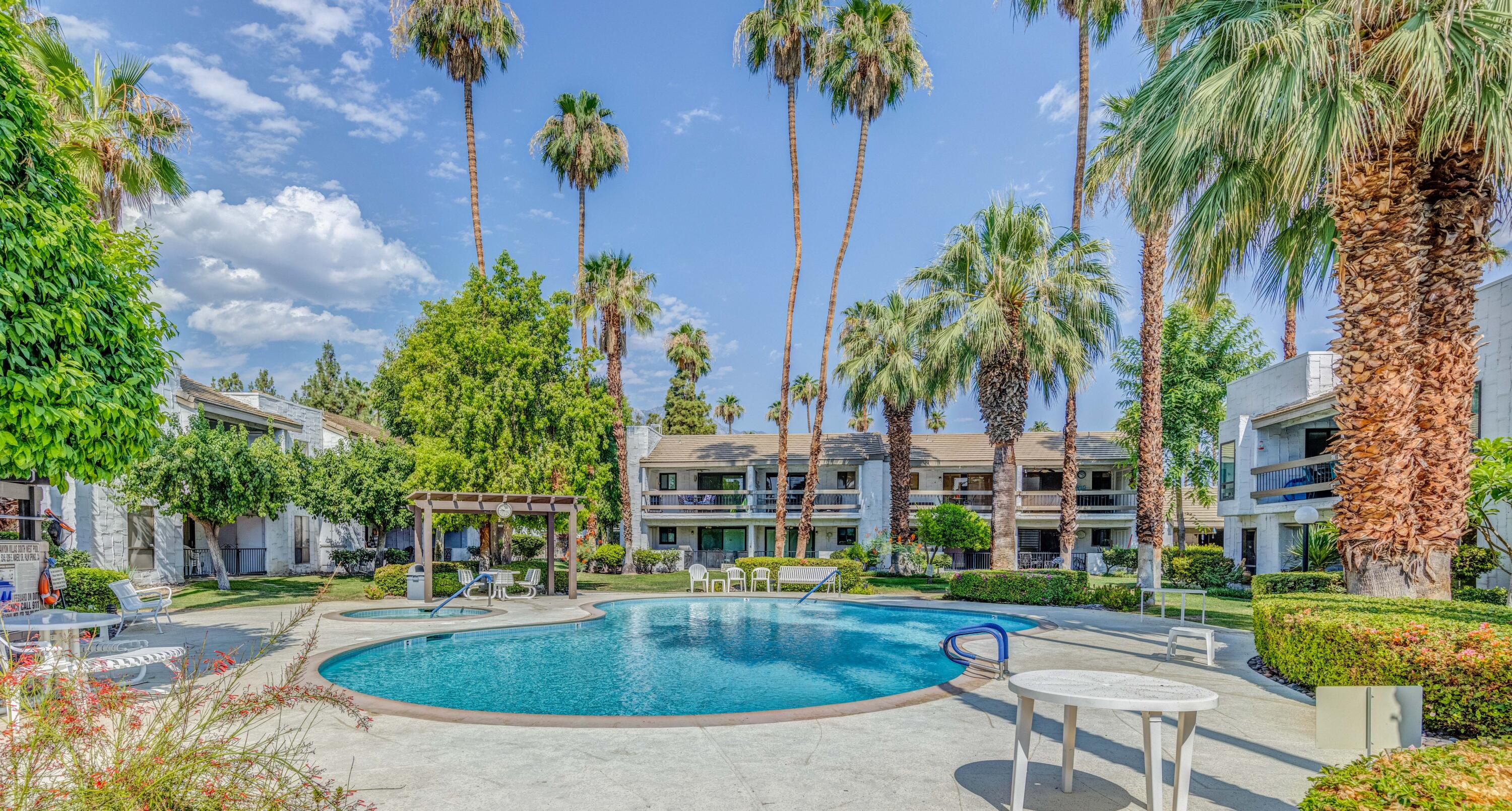 a view of a swimming pool with a patio