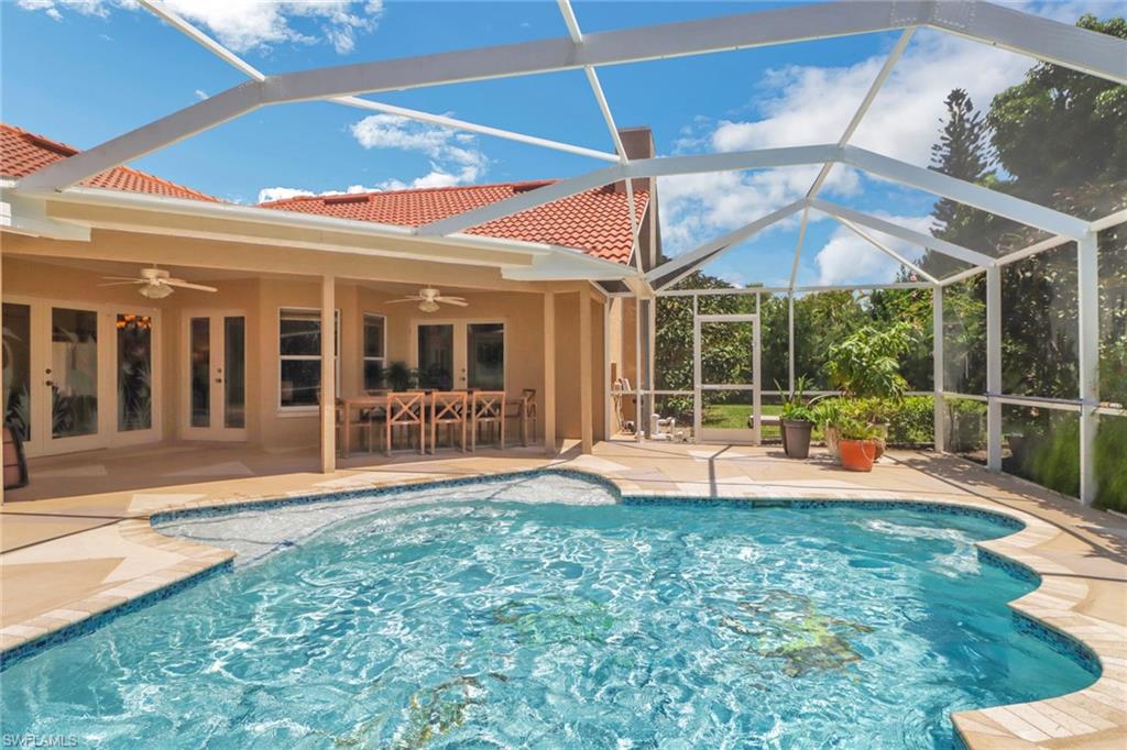 a view of a house with backyard sitting area and porch