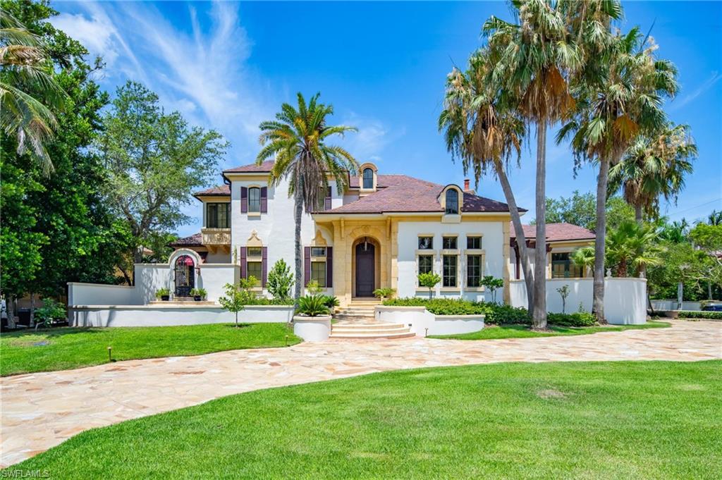 Mediterranean / spanish-style house featuring a front lawn