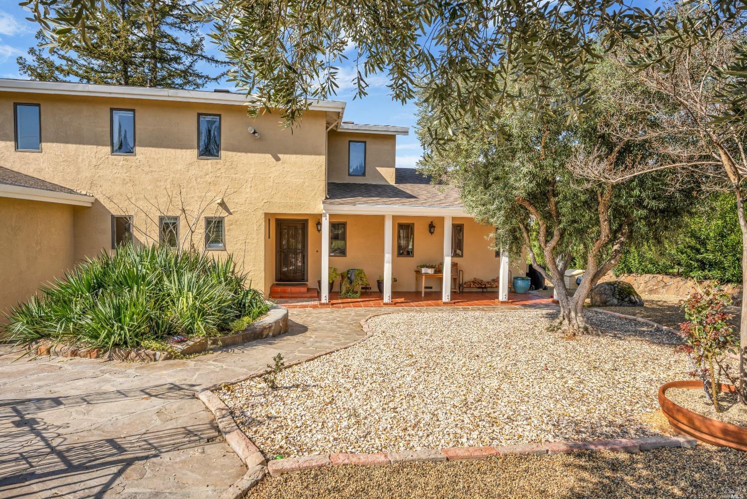 front view of a house with a rug