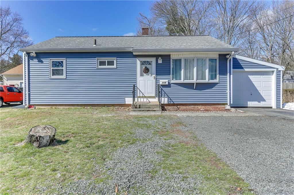 a view of a house with a backyard