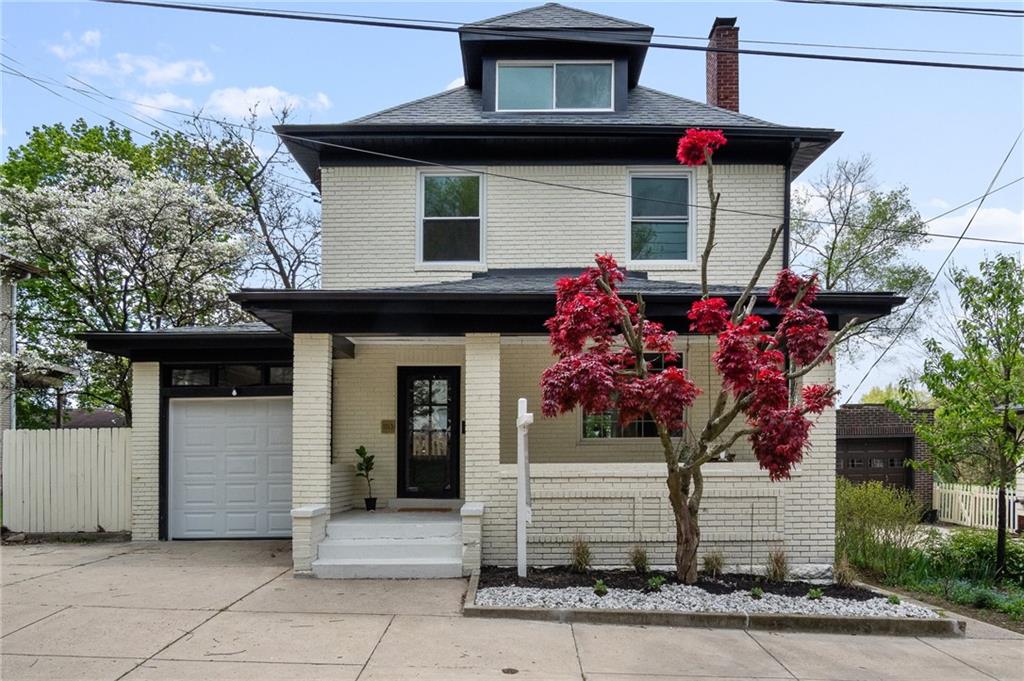 a front view of a house with a porch