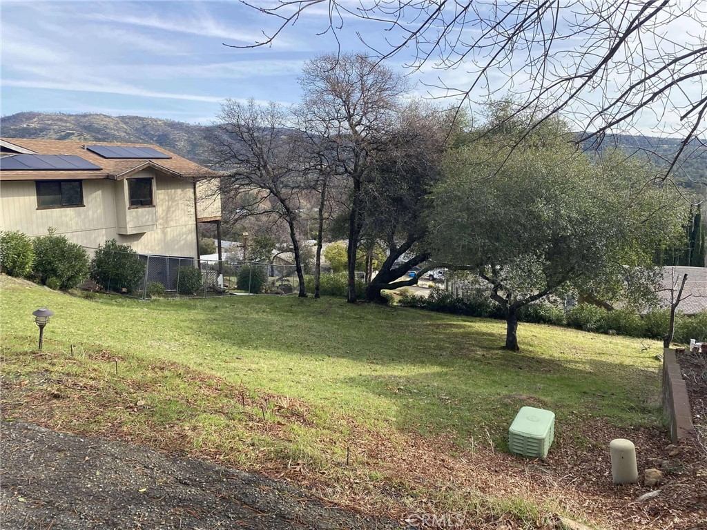 a view of a house with a backyard