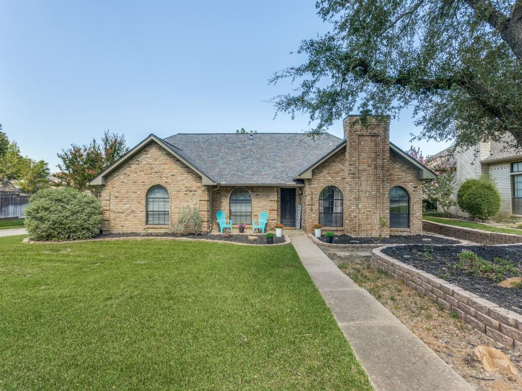 a front view of a house with yard