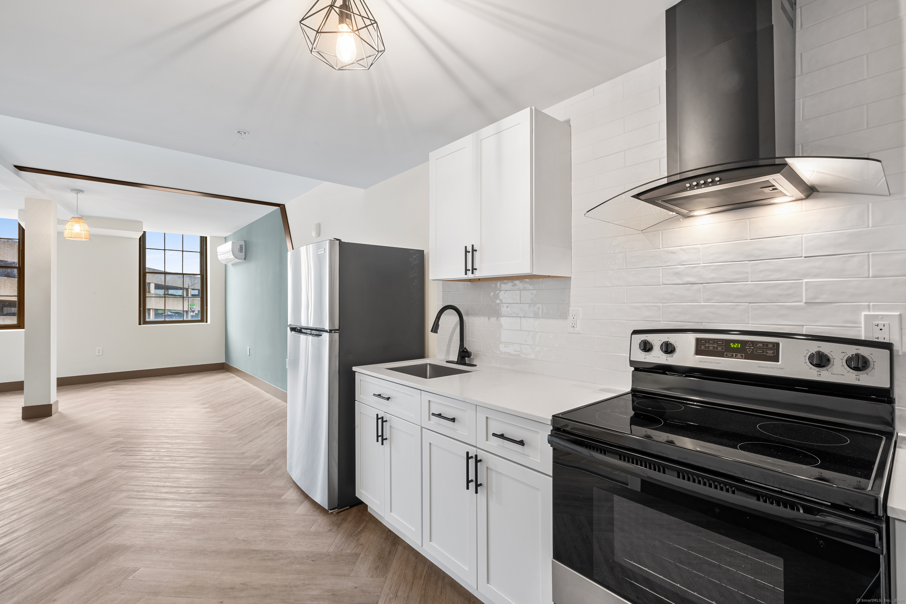 a kitchen with a stove and a microwave