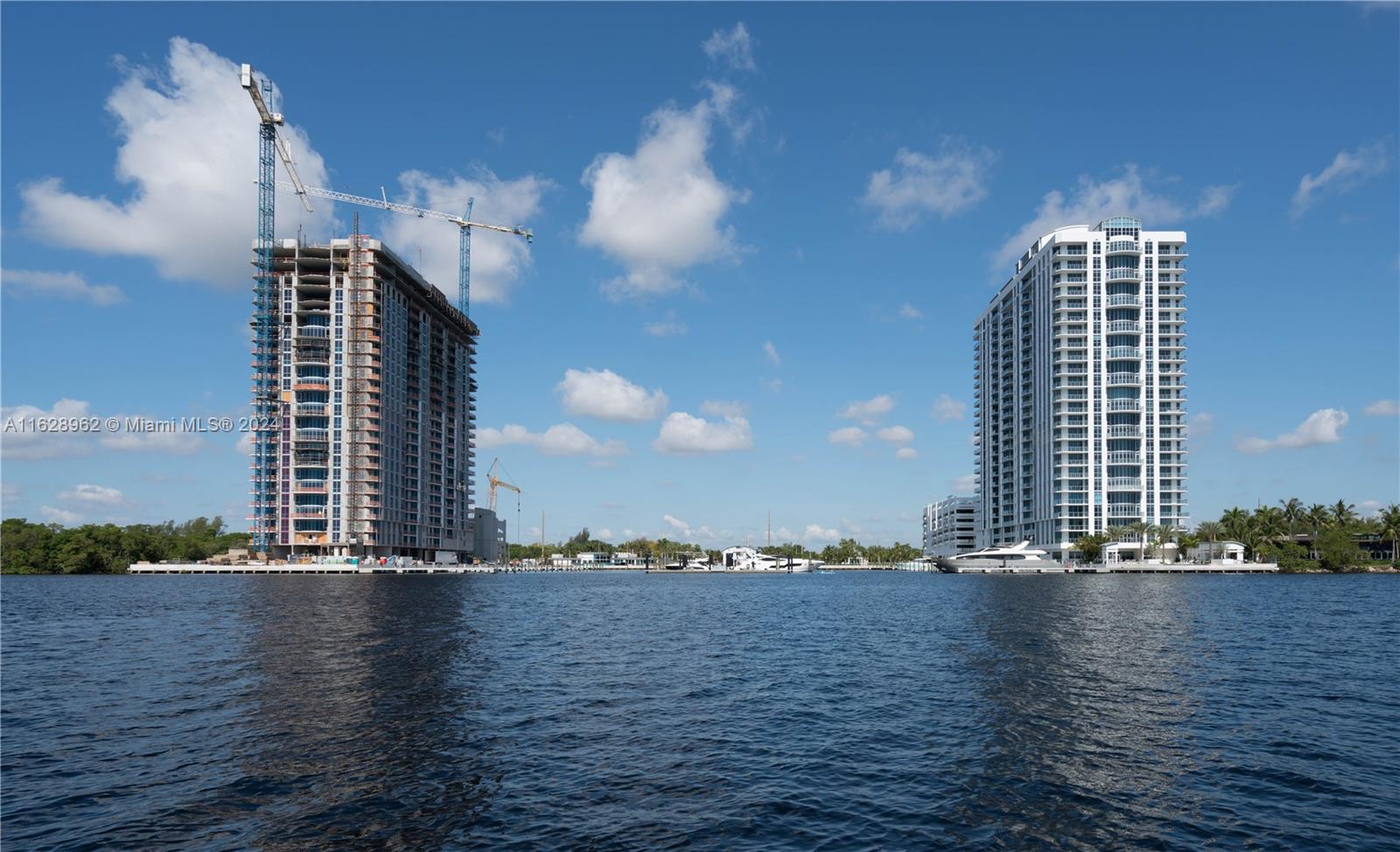 a view of building with outdoor space and a lake view