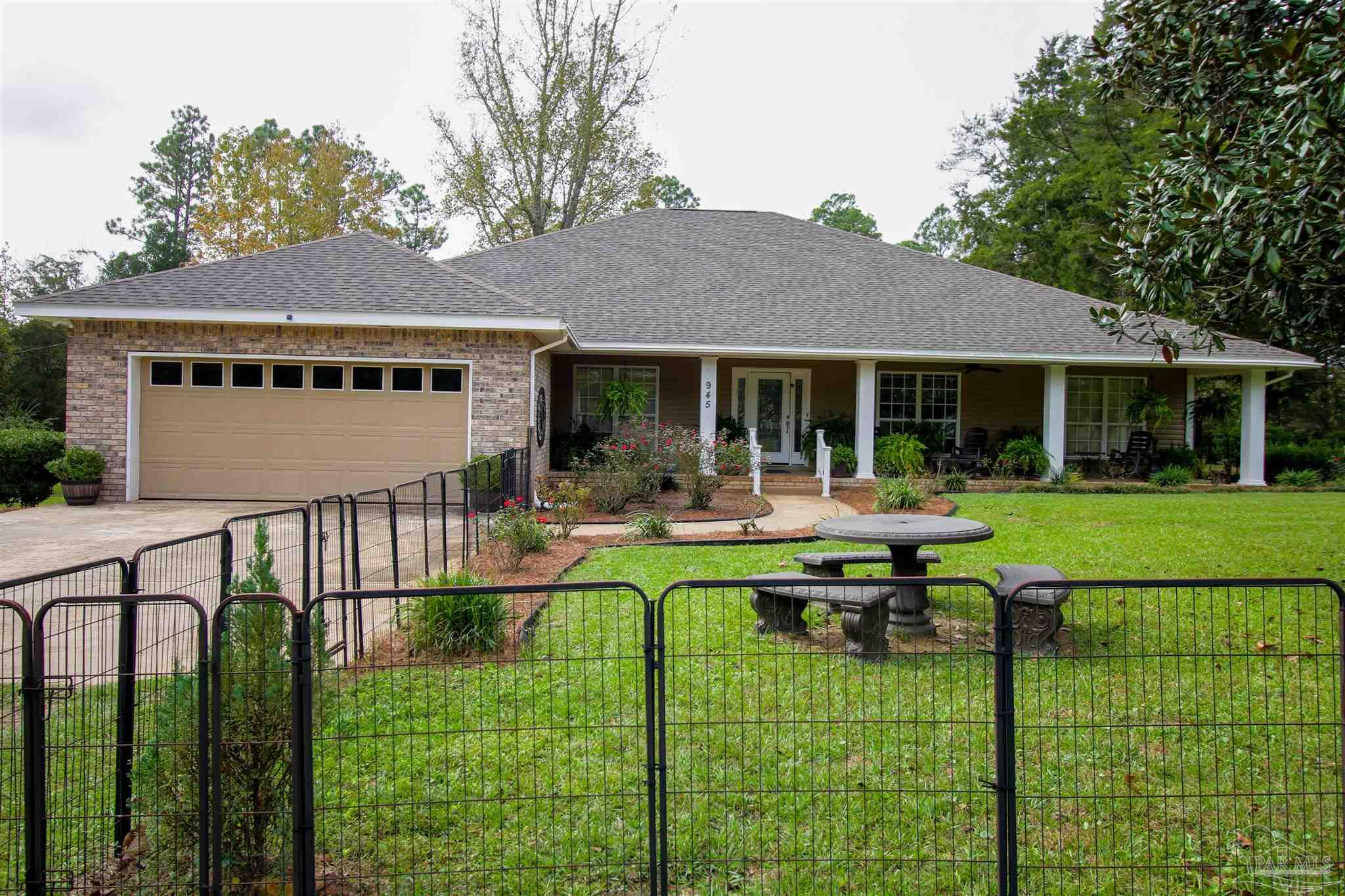 a view of house that has a yard