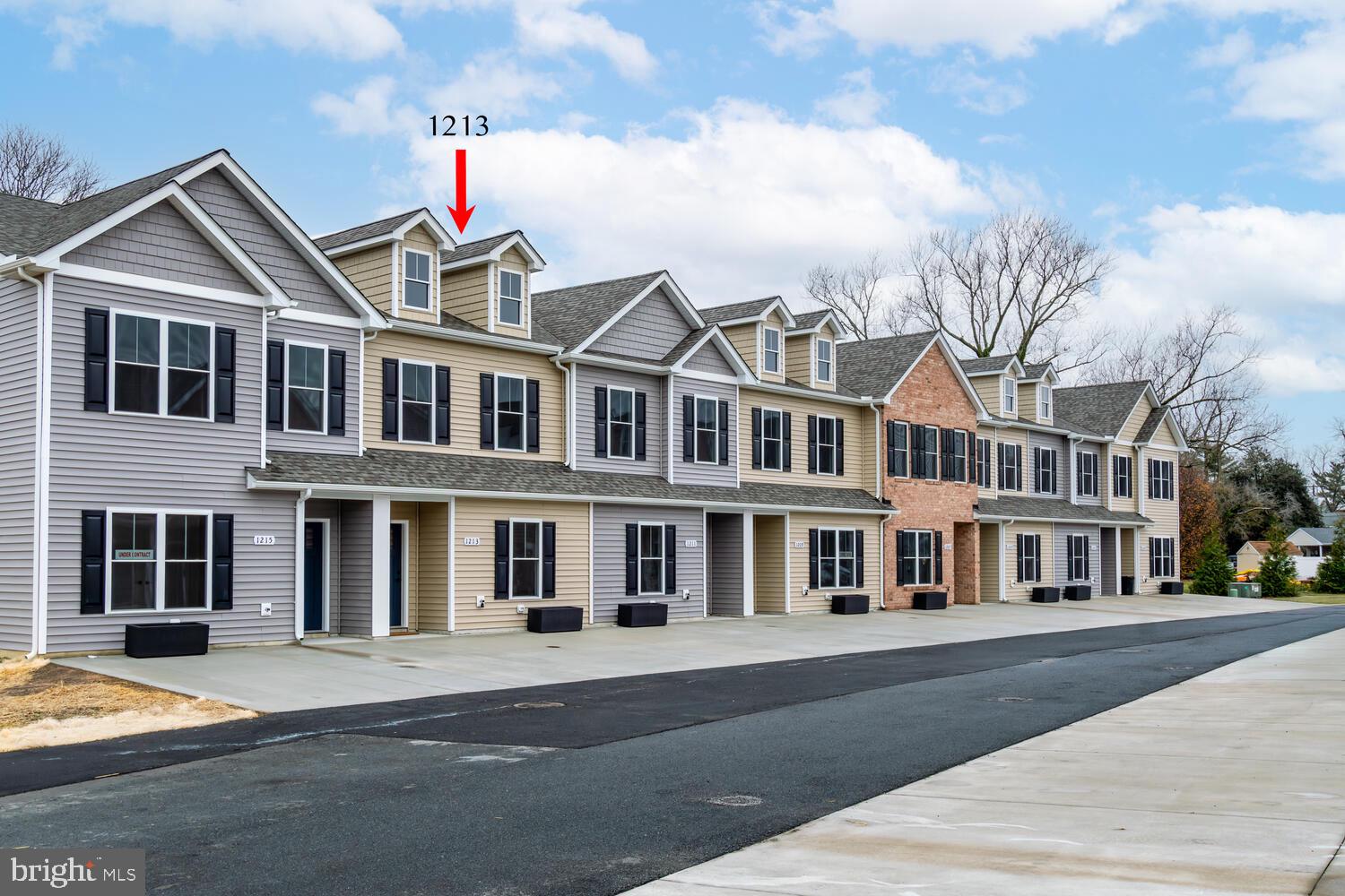 a front view of residential houses with street