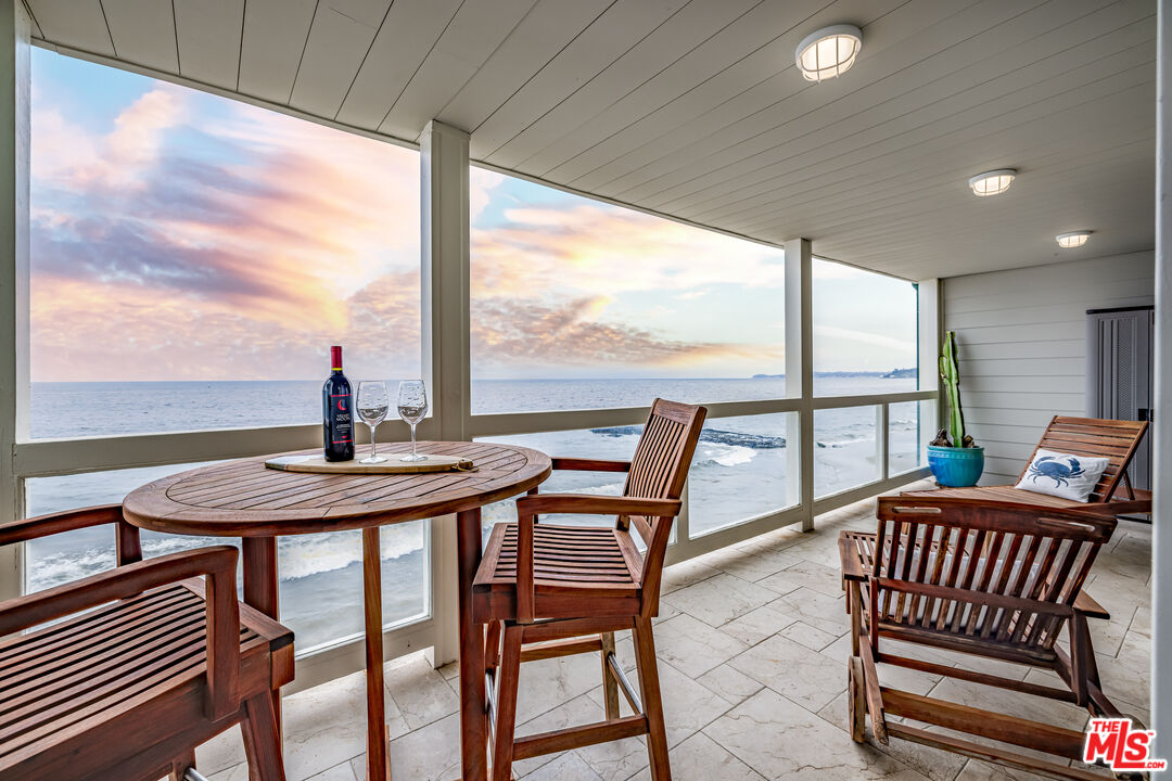 a view of a city from a dining room with furniture