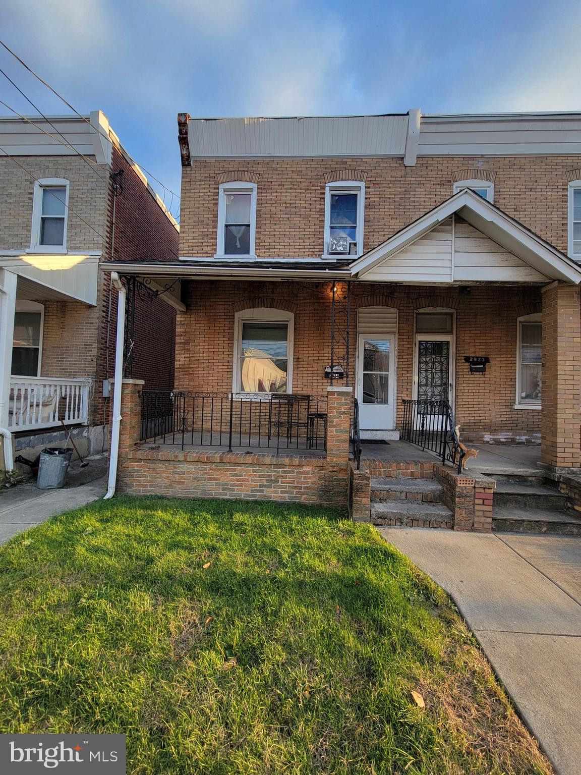 a front view of a house with a garden and patio