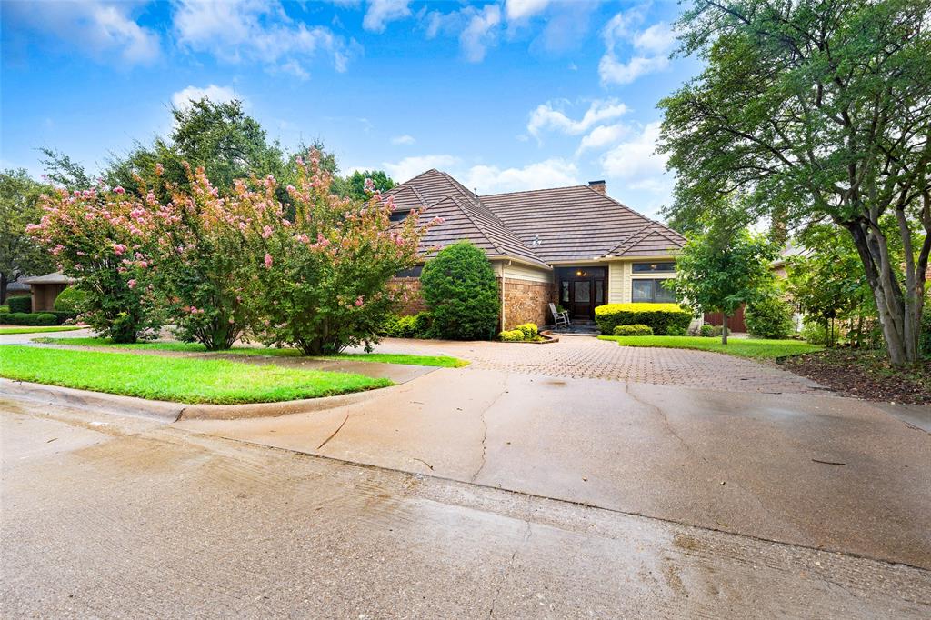 a view of house with yard and green space