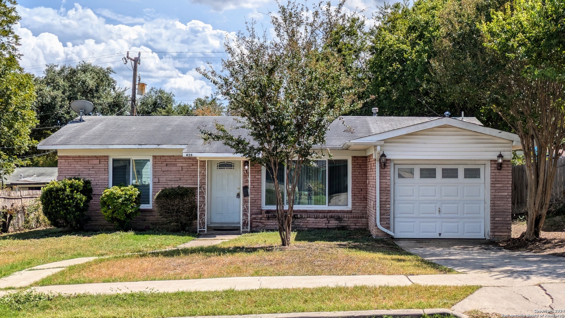 a view of a house with a garden