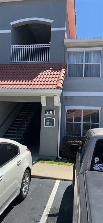 a view of a car park in front of house