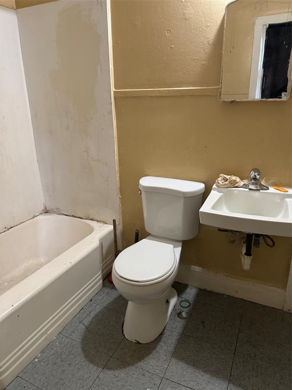 a bathroom with a sink and a toilet